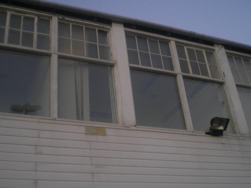 An upstairs window at the back of the old building