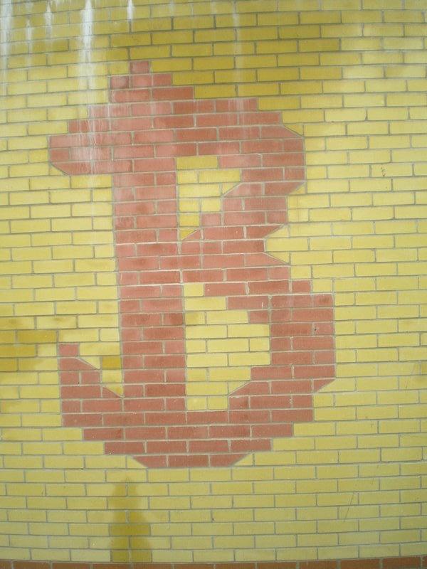 B in the brickwork of the doomed sports facilities behind the old reception building