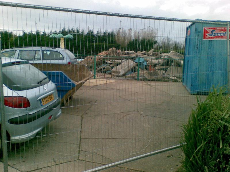 A pile of rubble (possibly the crazy golf?) beside the outdoor funpool