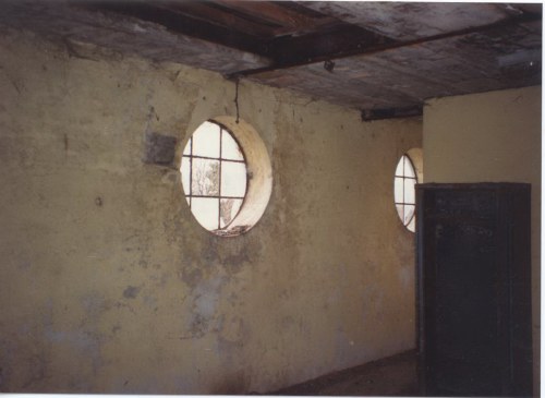 Rear wall of projection room showing round windows