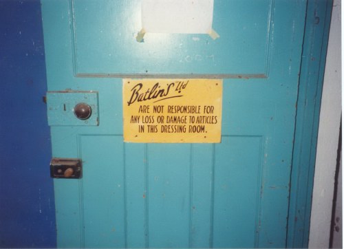 Dressing room door on right of stage